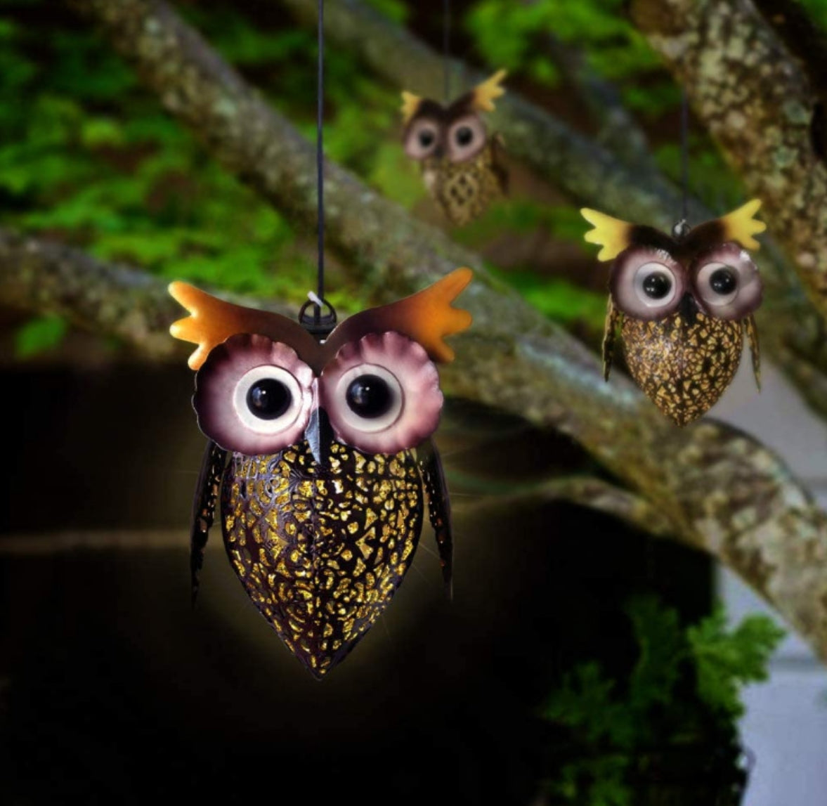 A owl shaped garden solar light with iron hollow pendant light